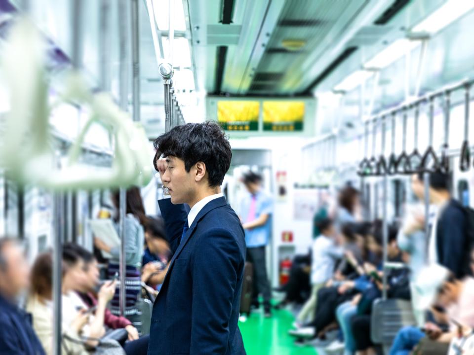 Businessmen commuting by train in Seoul