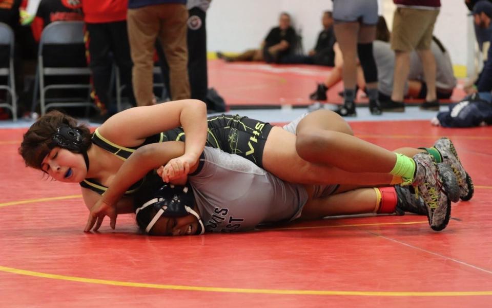 Ventura's Bela Smith pins an opponent during the Queen of the Hill tournament in Corona. Smith finished second in the 150-pound division.