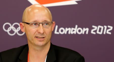 Thomas Lund, secretary general of the Badminton World Federation, speaks at a news conference during the London 2012 Olympic Games August 1, 2012. REUTERS/Bazuki Muhammad