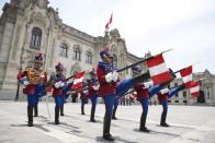 Peruvian soldiers march at the main yard of the Government palace in Lima<br><br> <p>Read more: <a href="http://in.lifestyle.yahoo.com/travel-postcard-48-hours-lima-peru-101853822.html" data-ylk="slk:Travel Postcard - 48 hours in Lima, Peru;elm:context_link;itc:0;sec:content-canvas;outcm:mb_qualified_link;_E:mb_qualified_link;ct:story;" class="link  yahoo-link">Travel Postcard - 48 hours in Lima, Peru</a></p>