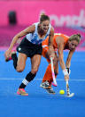 LONDON, ENGLAND - AUGUST 10: Luciana Aymar #8 of Argentina battles for the ball against Eva De Goede #24 of Netherlands during the first half of the Women's Hockey gold medal match on Day 14 of the London 2012 Olympic Games at Hockey Centre on August 10, 2012 in London, England. (Photo by Mike Hewitt/Getty Images)