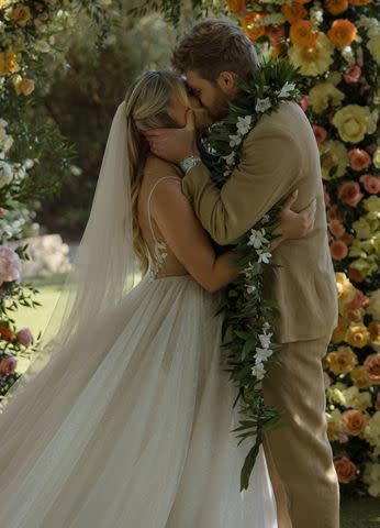 <p>AP Imagery, Andreana Peterson</p> Hype House alums Alex Warren and Kouvr Annon at their wedding at the Ethereal Gardens in Escondido, Calif., June 22.