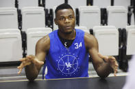 Kentucky's Oscar Tshiebwe answers a question during the school's NCAA college basketball media day in Lexington, Ky., Wednesday, Oct. 20, 2021. (AP Photo/James Crisp)