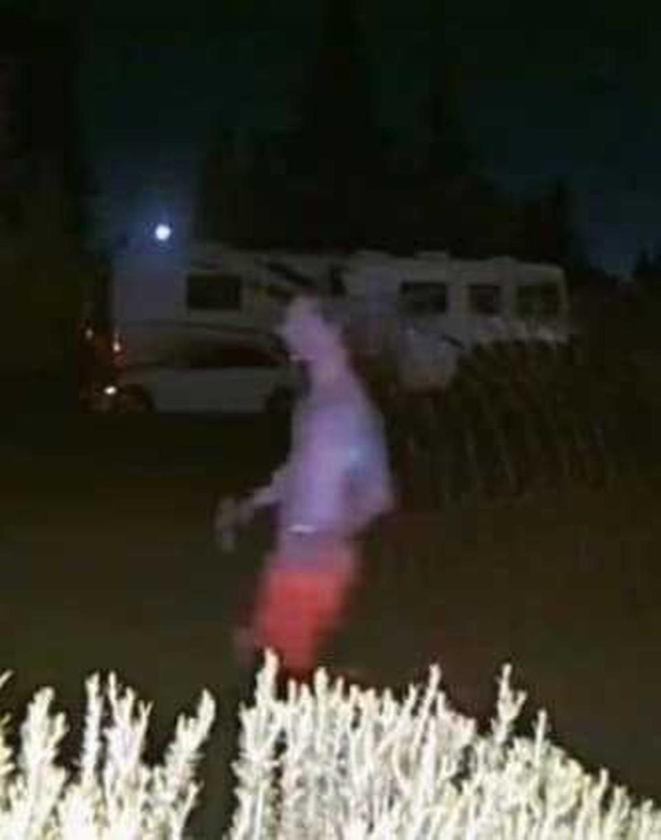 In an image released by the Placer County Sheriff’s Office, Eric Abril is seen on a doorbell video camera more than a mile from Roseville Sutter Medical Center around 6 a.m. on Sunday. Abril had escaped custody while being hosptalized.