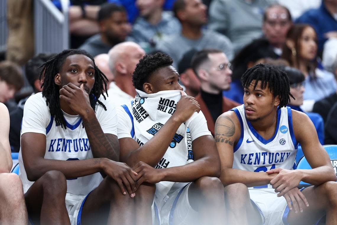 Kentucky’s Aaron Bradshaw, left, Adou Thiero and D.J. Wagner watch from the bench near the end of the Wildcats’ first-round NCAA Tournament loss to Oakland on Thursday.