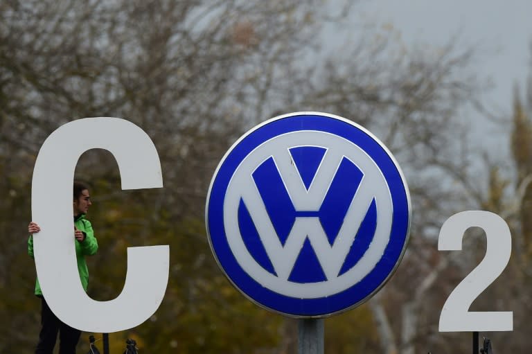 A Greenpeace activist makes a CO2 sign at Volkswagen's headquarters in Wolfsburg, on November 9, 2015