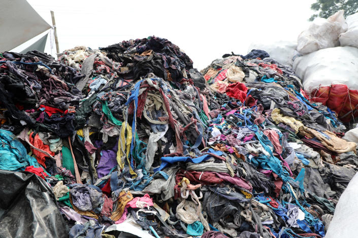 DHAKA, BANGLADESH - SEPTEMBER 7: Garment factory waste at a dumping site in Savar on September 7, 2022 in Dhaka, Bangladesh.  Bangladesh produced 1,000 tonnes of textile waste in 2021, up to November this year, potentially amounting to a billion dollars worth of recycled textiles, a new global report says.