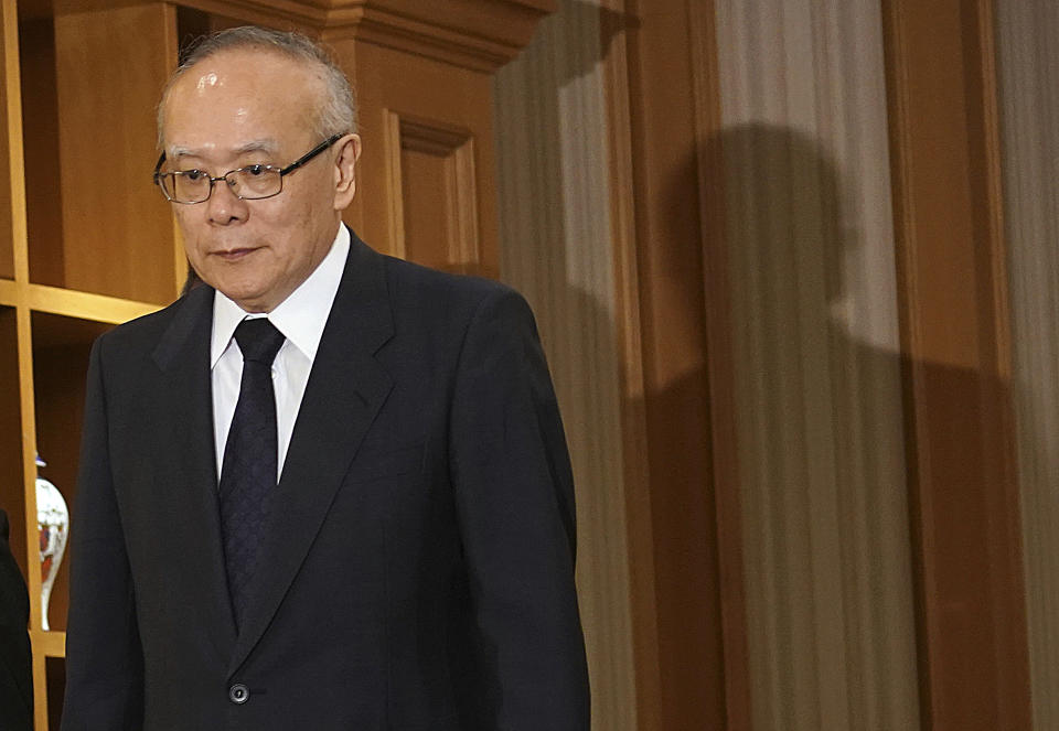 Tetsuo Yukioka, managing director of Tokyo Medical University, arrived for a press conference Tuesday, Aug. 7, 2018, in Tokyo. The university has been investigating a reported allegation that it has discriminated against female applicants. (AP Photo/Eugene Hoshiko)