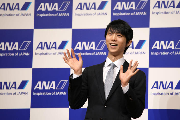 Two-time Olympic champion Yuzuru Hanyu of Japan, gestures during a press conference in Tokyo, Tuesday, July 19, 2022. Hanyu is stepping away from competitive figure skating, he said Tuesday. (AP Photo/Shuji Kajiyama)