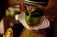 <p>An Indian Kathakali artist prepares backstage for his performance during a cultural festival at Kalakshetra Art Village in Chennai on September 7, 2016. </p>
