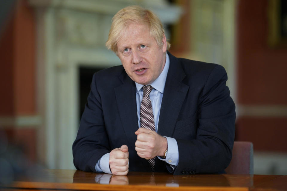 In this photo issued by 10 Downing Street on Sunday, May 10, 2020, Britain's Prime Minister Boris Johnson delivers an address on lifting the country's lockdown amid the coronavirus pandemic.  Johnson announced a modest easing of the country’s coronavirus lockdown and outlined his government’s road map for further lifting restrictions in the coming months. In a televised address to the nation, Johnson said people in Britain who can’t work from home, such as those in construction or manufacturing jobs, “should be actively encouraged to go to work” this week. (Andrew Parsons/10 Downing Street via AP)