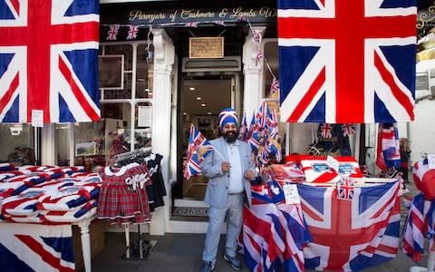 Shopkeeper Roshan Sang outside his shop on the high street. - Credit: Jeff Gilbert for The Telegraph 