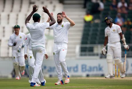 Cricket - South Africa v Sri Lanka - Third Test cricket match - Wanderers Stadium, Johannesburg, South Africa - 14/1/17 - South Africa's Kagiso Rabada and Wayne Parnell celebrate the wicket of Sri Lanka's Suranga Lakmal. REUTERS/James Oatway