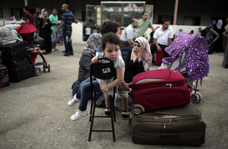 Palestinians wait at Rafah crossing