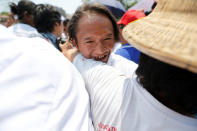 A newly released prisoner, part of over 8,000 inmates granted amnesty by Myanmar's President Win Myint to mark Myanmar's new year, hugs his family outside Insein prison in Yangon, Myanmar April 17, 2018. REUTERS/Ann Wang