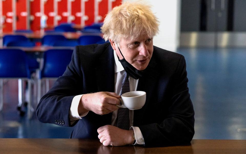 Boris Johnson, pictured during a visit to an academy in London last month, is '99 per cent' certain to announce the change on Monday, according to a source - Dan Kitwood/Pool via Reuters
