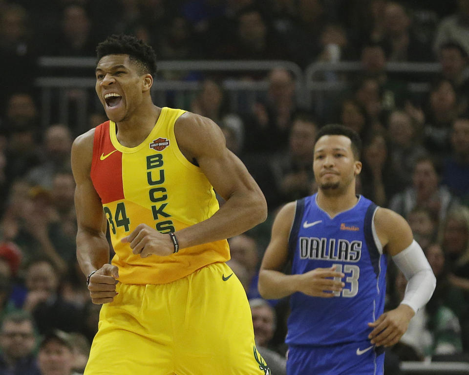 Milwaukee Bucks' Giannis Antetokounmpo (34) reacts after a dunk during the first half of an NBA basketball game against the Dallas Mavericks Monday, Jan. 21, 2019, in Milwaukee. (AP Photo/Aaron Gash)