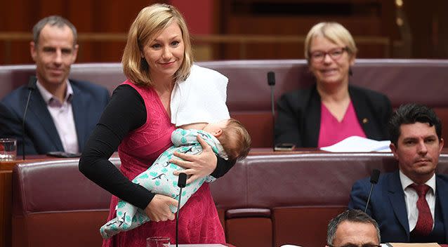 Australian Greens Senator Larissa Waters puts forward a motion on Black Lung disease while breastfeeding her daughter. Source: AAP Image/Lukas Coch