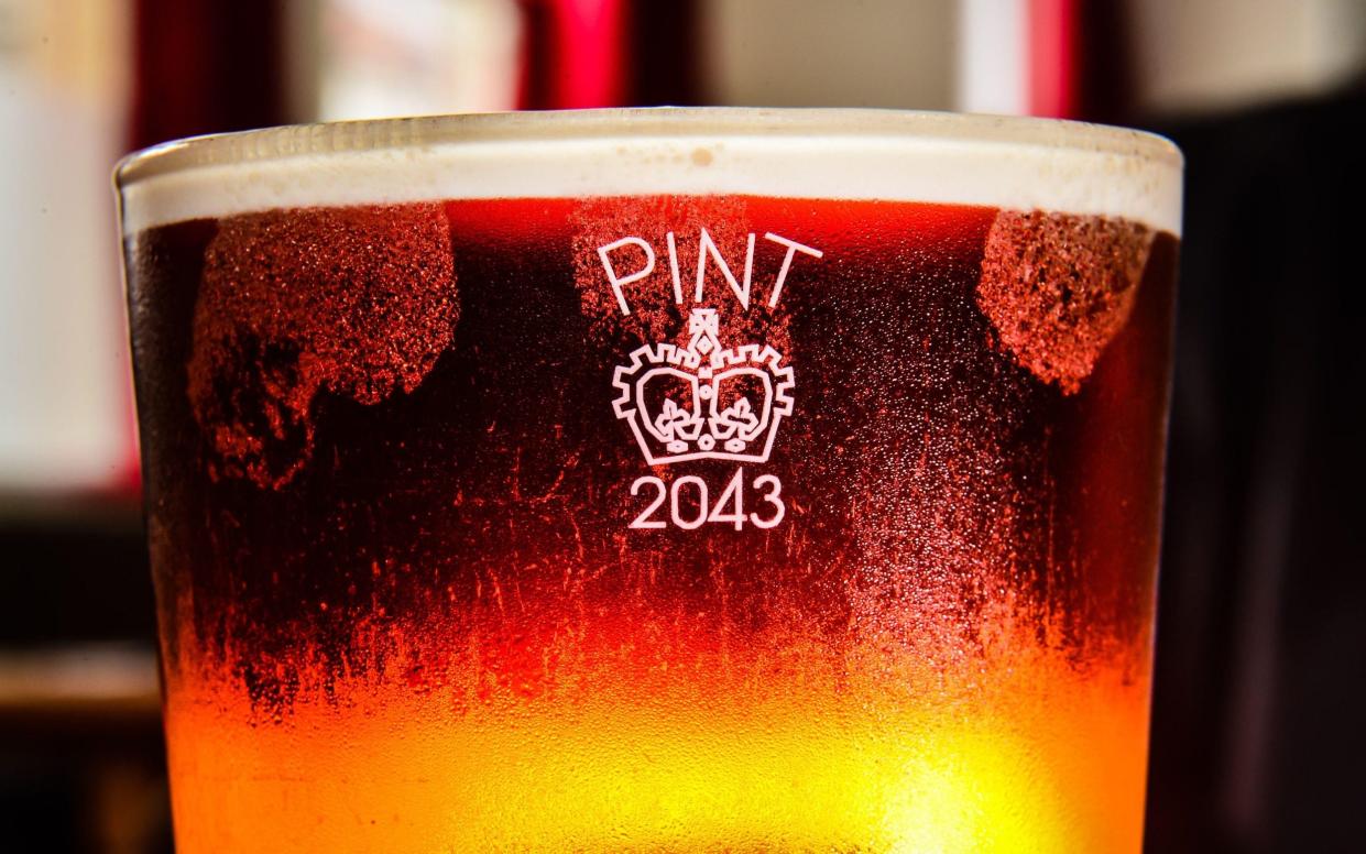 A pint glass etched with the Crown stamp rather than the European CE marking - PA images