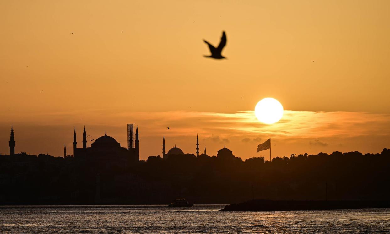 <span>‘The evening unfurled like a ribbon,’ wrote Ahmet Hamdi Tanpinar of Istanbul’s sunsets, ‘whose colours ran from wine dark to golden.’</span><span>Photograph: Anadolu/Getty Images</span>