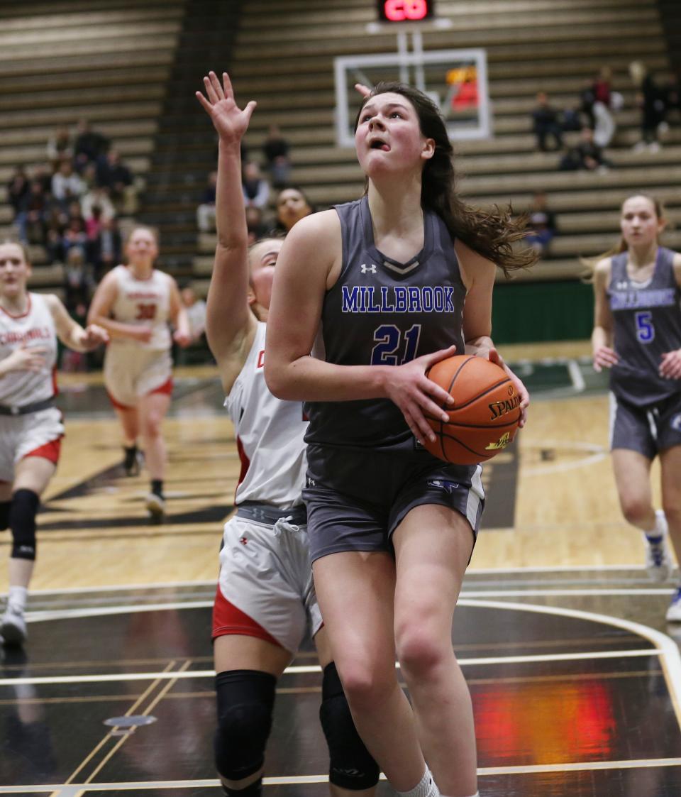 Millbrook's Natalie Fox (21) drives to the basket against Newark Valley during the New York State Class C championship game at Hudson Valley Community College in Troy, New York March 20, 2022.  Millbrook won the game 55-46.