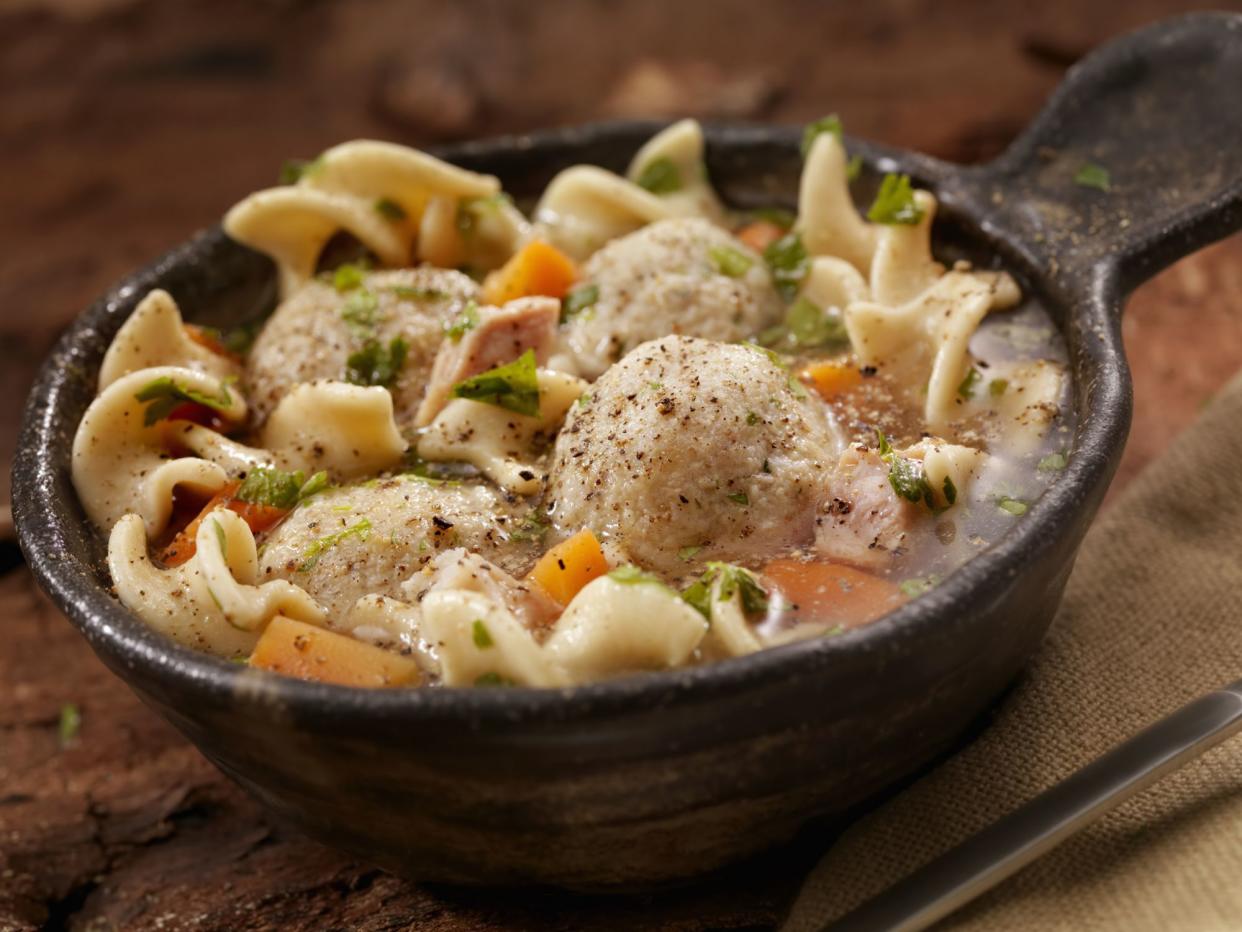 A classic favourite! Fluffy matzo balls floating in roasted chicken noodle soup.- Photographed on Hasselblad H3D2-39mb Camera