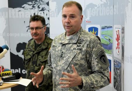 U.S. Army Europe commander Ben Hodges speaks as Polish general Boguslaw Samol stands during news conference during a visit to the Multinational Corps Northeast, NATO base at Szczecin in north-west Poland February 11, 2015. REUTERS/Cezary Aszkielowicz/Agencja Gazeta