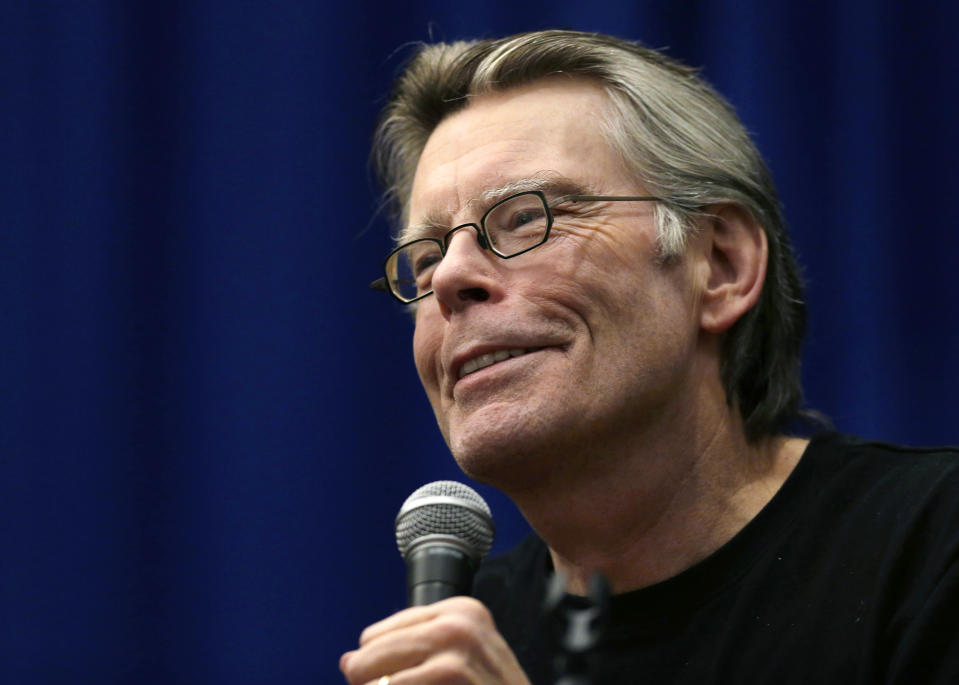 FILE - In this Dec. 7, 2012, file photo, novelist Stephen King speaks to creative writing students at the University of Massachusetts-Lowell in Lowell, Mass. King says he still lives in Maine, and he insists that Gov. Paul LePage's claim that he has moved from the state is inaccurate. (AP Photo/Elise Amendola, File)