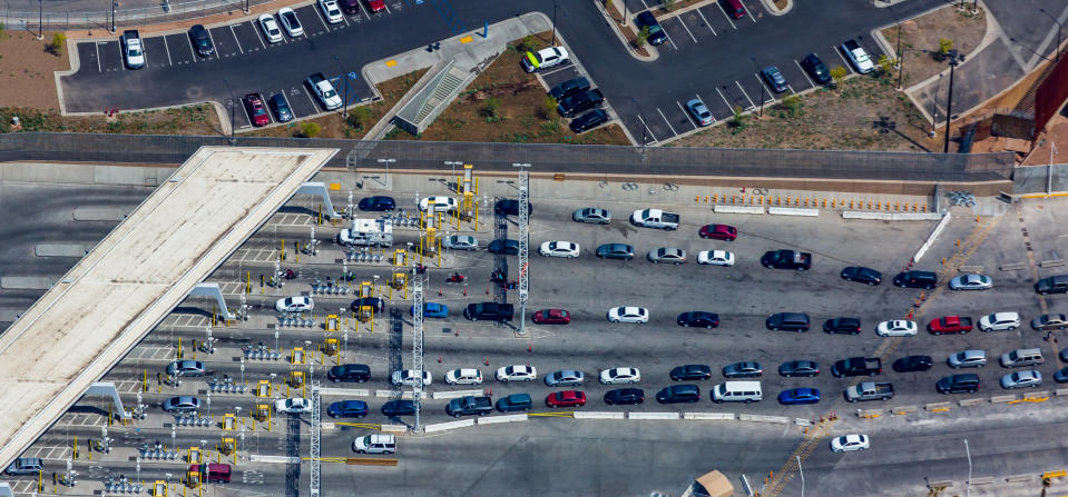 FILE - This April 2, 2019, file photo shows the port of entry from Mexicali, Mexico to Calexico, Calif. An increasing number of American citizens have been apprehended as they have tried to smuggle illegal drugs into the U.S. since the start of the coronavirus pandemic, an uptick that's come amid travel restrictions at the border with Mexico. (Mark Holtzman/West Coast Aerial Photography Inc. via AP,File)