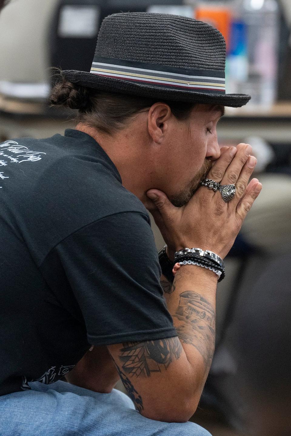 Brett Cross, father of Uvalde shooting victim Uziyah Garcia, rests his face in his hands during the Department of Public Safety Commission meeting on Uvalde at DPS Headquarters on Thursday, Oct. 27, 2022. 