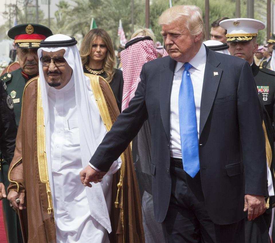 Trump and King Salman walk together during the welcome ceremony prior to their meeting at Al-Yamamah Palace in Riyadh, Saudi Arabia, on May 20, 2017.