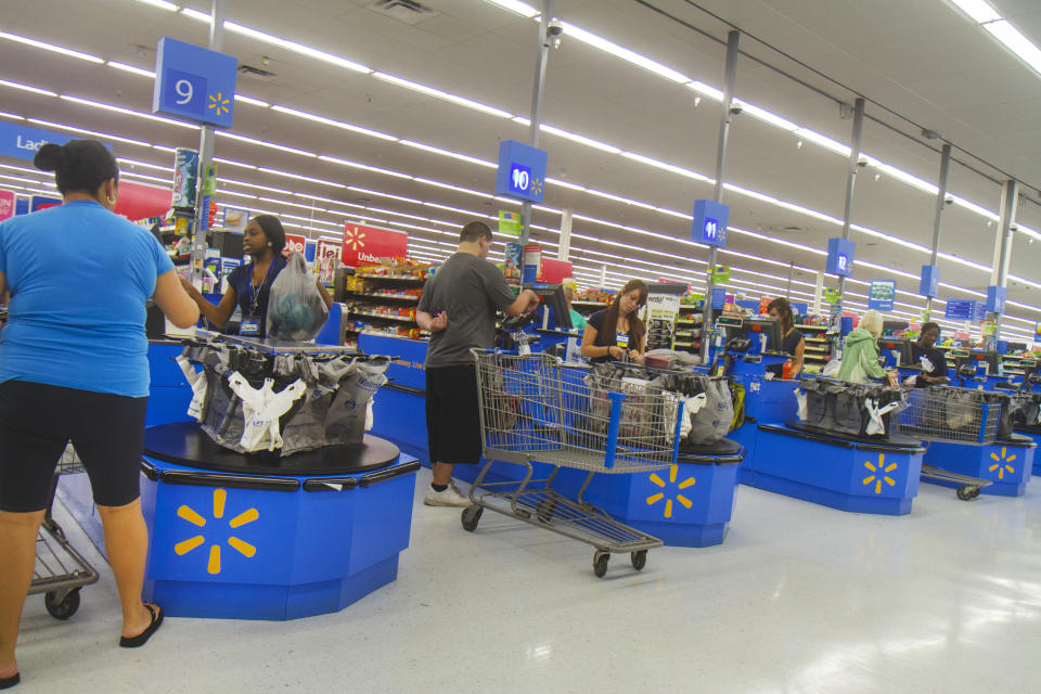 The check out inside Walmart. (Photo by: Jeffrey Greenberg/Universal Images Group via Getty Images)