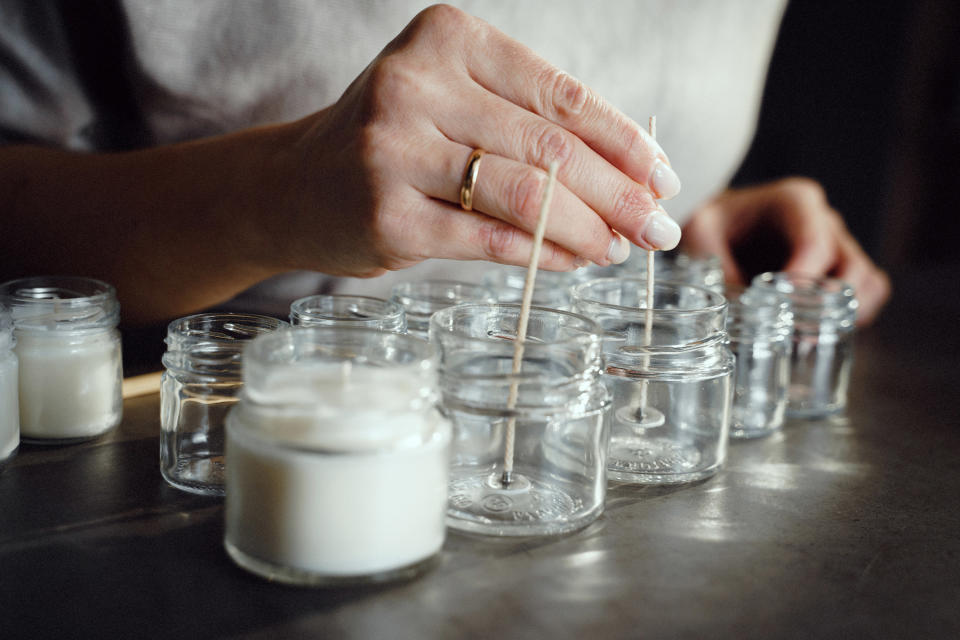 a pair of hands making a candle