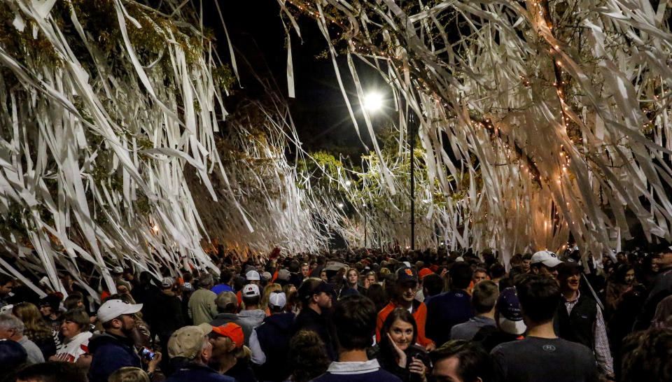 Auburn fans roll Toomer’s corner after the Iron Bowl NCAA football game, Saturday, Nov. 25, 2017, in Auburn, Ala. (AP Photo/Butch Dill)