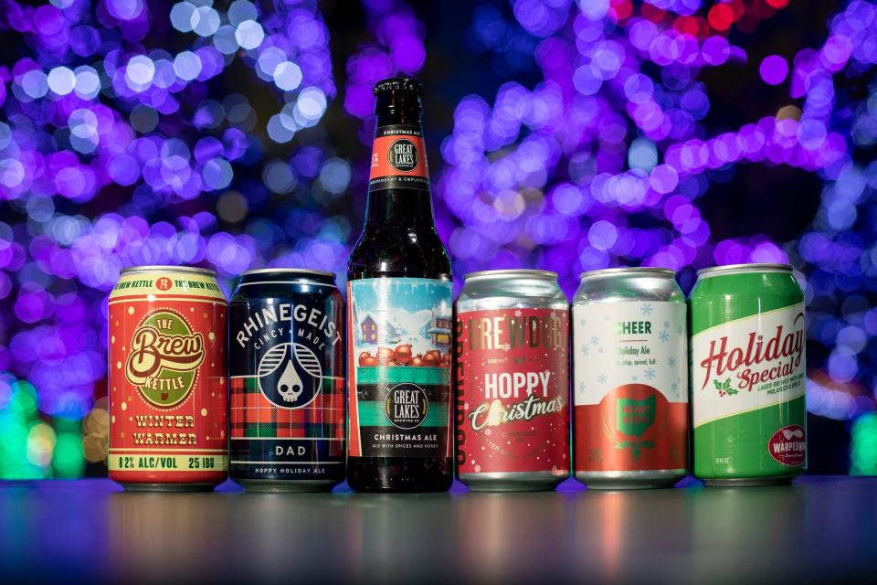 Winter holiday beers, from left: The Brew Kettle Winter Warmer; Rhinegeist Dad; Great Lakes Christmas Ale; Brewdog Hoppy Christmas; Heart State Cheer; and Warped Wing Holiday Special