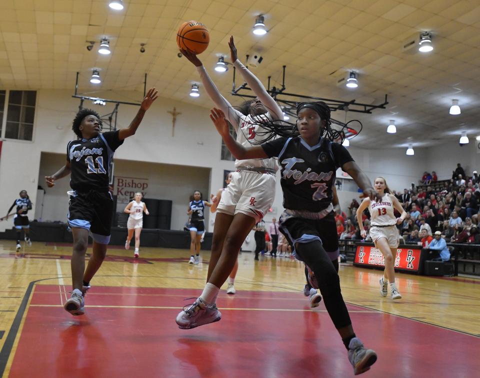 Bishop Kenny's Sydney Roundtree (5) goes up for a shot against Ribault in the Class 4A regional semifinal. The Crusaders eliminated the 12-time state champion Trojans 70-43.