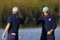 Team USA's Justin Thomas and Team USA's Jordan Spieth fist pump on the fifth hole during a foursome match the Ryder Cup at the Whistling Straits Golf Course Friday, Sept. 24, 2021, in Sheboygan, Wis. (AP Photo/Ashley Landis)