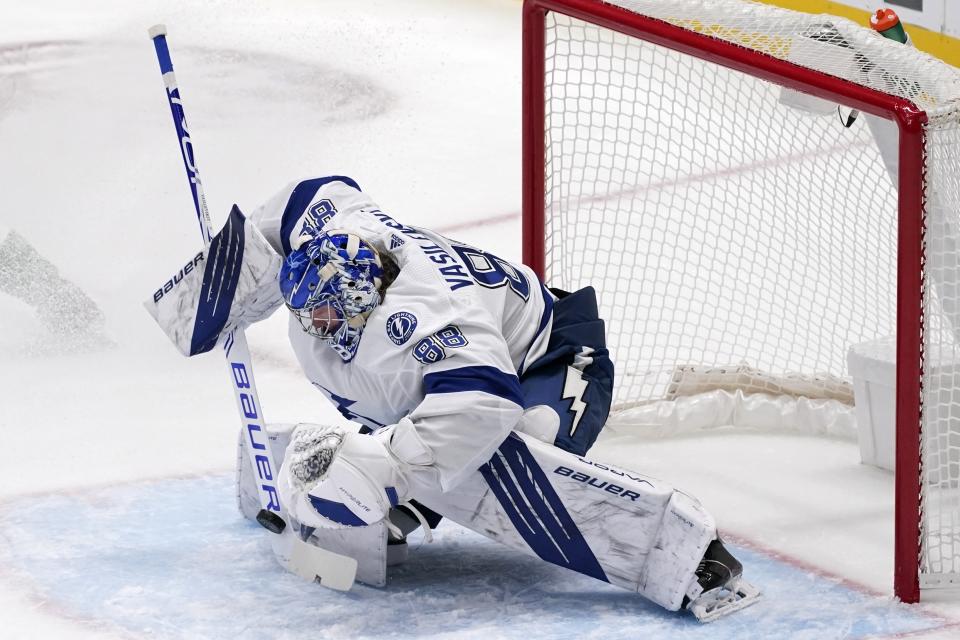 Tampa Bay Lightning goaltender Andrei Vasilevskiy blocks a shot from the Dallas Stars in the second period of an NHL hockey game in Dallas, Tuesday, March 2, 2021. (AP Photo/Tony Gutierrez)