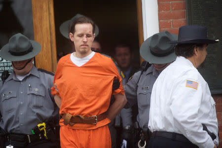 FILE PHOTO -- Eric Matthew Frein exits the Pike County Courthouse with police officers after an arraignment in Milford, Pennsylvania, October 31, 2014.REUTERS/Mark Makela/File Photo