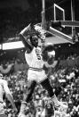 FILE - Philadelphia 76ers' Darryl Dawkins dunks against the Atlanta Hawks in an NBA playoff game in Philadelphia, on April 15, 1980. Bill Willoughby helped pave the way for future prep stars when he and Dawkins became the first high school players selected in the NBA draft, both in 1975. (AP Photo/Rusty Kennedy, File)