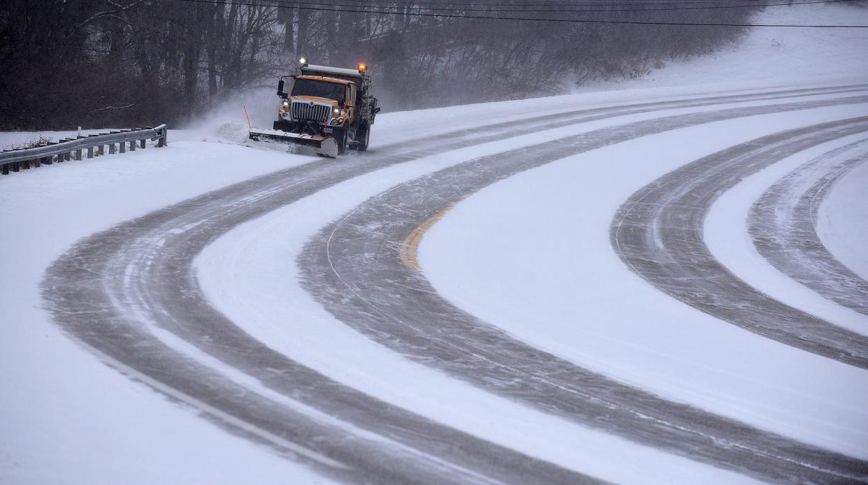 A Missouri Department of Transportation snow plow clears the shoulder of Stadium Boulevard near College Park Drive last February.