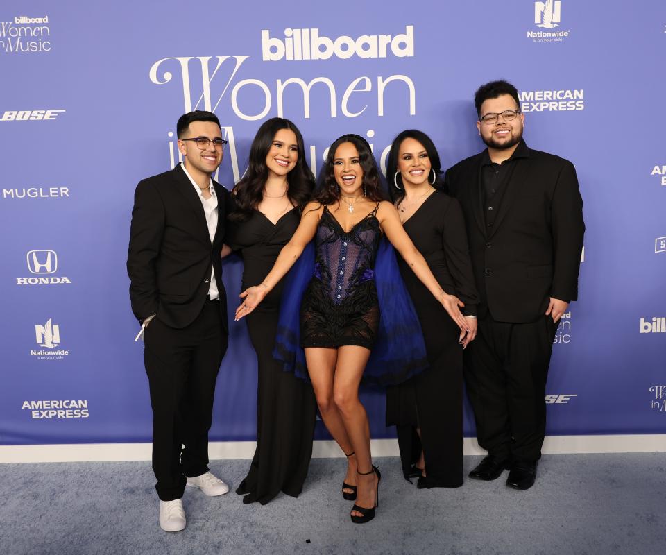 Becky G attended the Billboard Women in Music in her hometown of Inglewood, Calif., with her family. She was honored with the Impact Award by Dove Cameron.