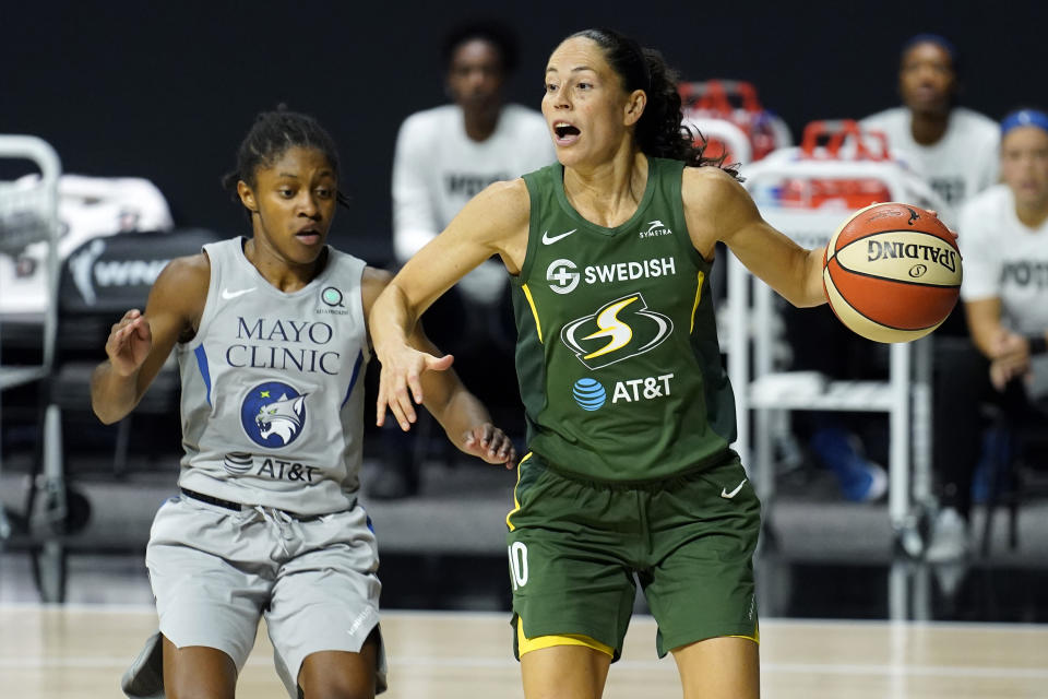 Seattle Storm guard Sue Bird (10) drives around Minnesota Lynx guard Crystal Dangerfield (2) during the second half of Game 2 of a WNBA basketball semifinal round playoff series Thursday, Sept. 24, 2020, in Bradenton, Fla. (AP Photo/Chris O'Meara)