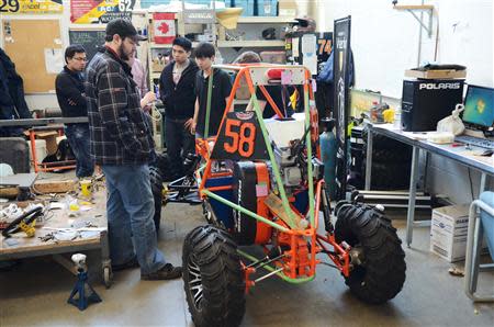 Students work on projects and new technologies in labs and workshops at the University of Waterloo, in Waterloo, Ontario, March 18, 2014. REUTERS/Euan Rocha