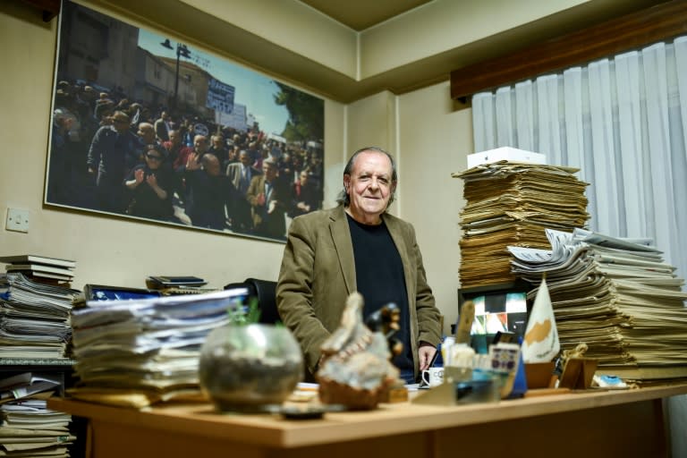 Sener Levent, chief editor of Afrika newspaper, poses for a picture in northern Nicosia on December 13, 2018
