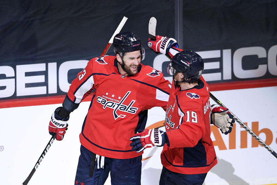 Washington Capitals right wing Tom Wilson (43) celebrates his second goal of the game with center Nicklas Backstrom (19) in the second period of an NHL hockey game against the New York Rangers, Sunday, March 28, 2021, in Washington. (AP Photo/Nick Wass)