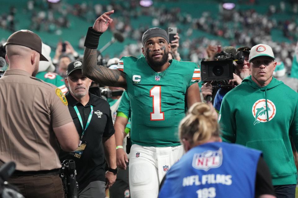 Miami Dolphins quarterback Tua Tagovailoa (1) walks off the field following a victory over Dallas Cowboys at Hard Rock Stadium in Miami Gardens, Dec. 24, 2023.