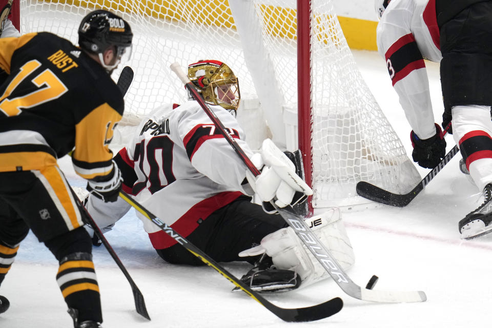 Ottawa Senators goaltender Joonas Korpisalo (70) blocks a shot by Pittsburgh Penguins' Bryan Rust (17) during the first period of an NHL hockey game in Pittsburgh, on Saturday, Oct. 28, 2023. (AP Photo/Gene J. Puskar)