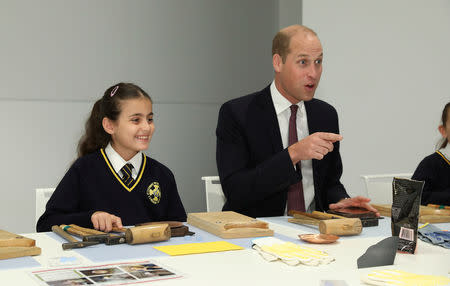 Britain's Prince William joins local school children from St Cuthbert with St Matthias CE Primary School at a copper beating workshop during the official opening of Japan House in London, Britain, September 13, 2018. Tim P. Whitby/Pool via REUTERS