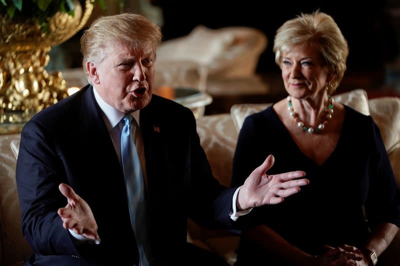 U.S. President Trump speaks to reporters with SBA Administrator McMahon at his side at Mar-a-Lago in Palm Beach, Florida